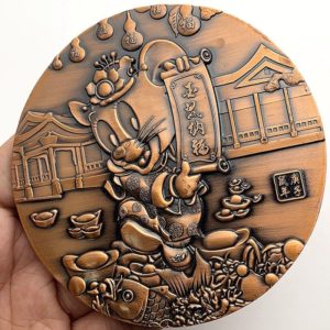 Mickey Mouse coins in relief